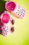 Baby Pink slippers with sunglasses on yellow background.Rubber beach shoe flat lay.Stylish beach flip-flops on color