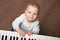 Baby play black and white piano