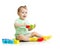 Baby playing with colorful wood building blocks