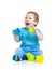 Baby playing with colourful cup toys on floor