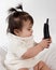 Baby playing with cordless phone