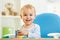 Baby playing education toy at table in nursery