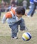 Baby playing football