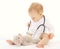 Baby playing and listens stethoscope