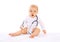 Baby playing with stethoscope sitting on white