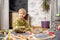 Baby playing with toy railroad, trains and cars on the floor