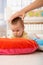 Baby on playmat concentrating