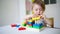 Baby plays in the constructor. small childputs the rings on the pins. concept of development of fine motor skills. game at home