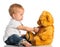 Baby plays in doctor toy bear and stethoscope