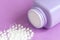 Baby powder on purple background