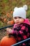 Baby in pumpkin patch wagon