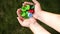 Baby puts plastic lids in mother`s hands. parent and his child collect cover. recyclable.