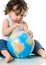 Baby with puzzle globe.