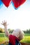 Baby Reaching for Balloons