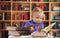 Baby reading in library - education concept