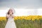 Baby rejoice to smile. beautiful girl in a white dress and a white hat.