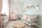 baby room, with crib and changing table, surrounded by beautiful pastel decor