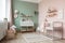 baby room, with crib and changing table, surrounded by dreamy pastel tones