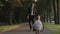 Baby running to meet his dad after work, businessman with bicycle at city park