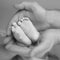 Baby\'s feet in daddy\'s hands