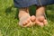 Baby\'s feet on a green grass