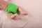 Baby`s feet and green reusable diaper.  Zero waste baby care concept