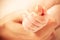 Baby\'s hand keeping mother finger