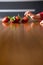 BabyÂ´s hand manipulating different fruits on a wooden table