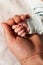 Baby\'s hand seeking in father\'s palm