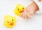 Baby\'s hands and duck toys