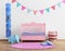 Baby\'s pink nursery room with flags and rug