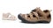 Baby sandals standing opposite male shoes, isolate
