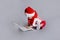 Baby santa claus with white laptop