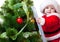 Baby in Santa costume on a step ladde