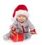 Baby in Santa hat playing with Christmas gift box