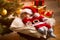 Baby Santa sleeping under Christmas tree with presents