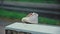 Baby Shoe Left Outdoor On Metal Box on Cold Rainy Day