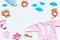 Baby shower concept. Baby`s clothes and toys on light background top view copy space