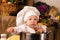 Baby sitting inside a large cooking stock pot