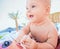 Baby sitting in little pool on the sea beach