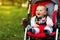 Baby in sitting stroller