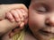 Baby sleep with father\'s finger