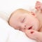 Baby, sleeping and bed in home, closeup and nursery with growth, development and wellness in room. Infant, child and