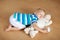 Baby sleeping on floor with toy and milk bottle.