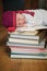 Baby sleeping on stack of books