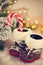 Baby Slippers Near With Candy Cane On Snowy Background