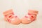 Baby sock with hearts on a wooden background