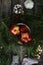 Baby socks and small shaped apples on dark background