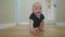 baby son crawling. happy family a first steps kid dream concept. baby newborn crawling down the hallway in the house