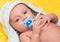Baby with soother (baby\'s dummy)